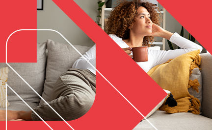 Client sitting on a couch with a mug, enjoying the success of personalized sleep, stress management, and recovery plan from their Sleep, Stress Management and Recovery Coach